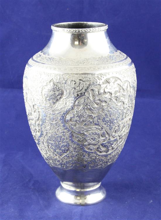 A 20th century Persian white metal vase, 8in.